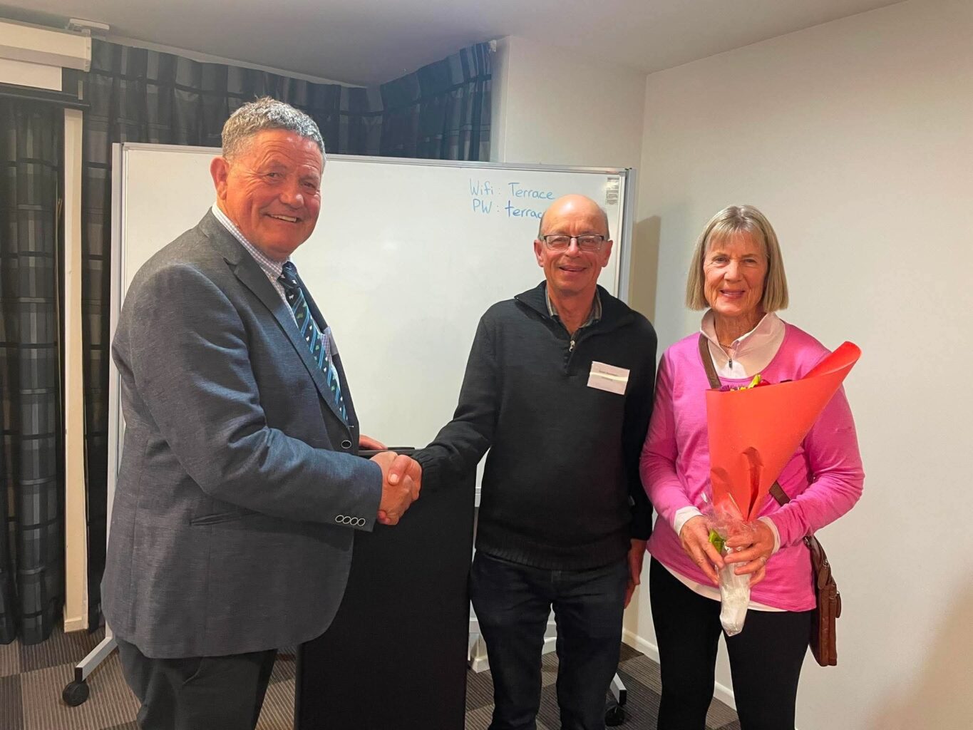 Chris Medlicott, President of the Southdown Sheep Spciety of NZ presents Stuat Brannigan with Honorary Life Membership